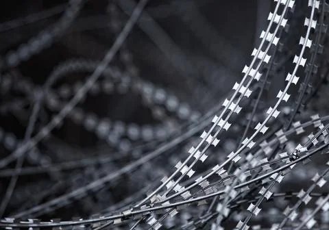 Barbed wire in grunge style process. Stock Photos