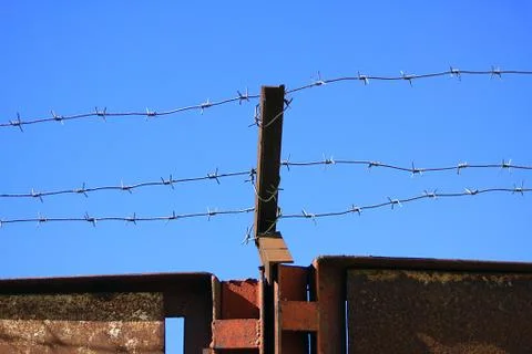 Barbed wire over the gates Stock Photos