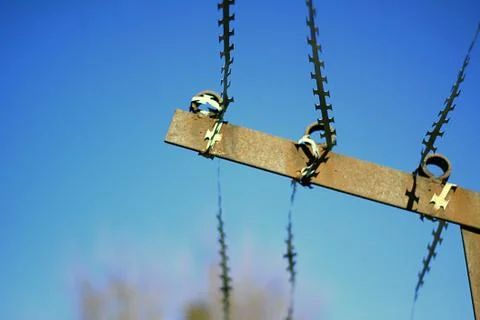 The barbed wire over the wall Stock Photos