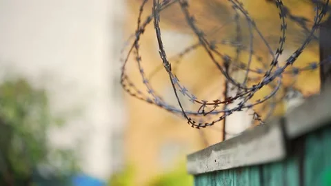 Barbed wire. Prison fence. View at the barb wall of the crime area. 動画素材 170457404