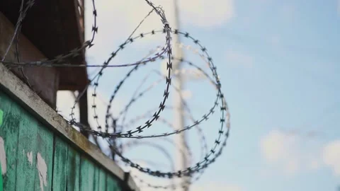 Barbed wire. Prison fence. View at the barb wall of the crime area. Stock Footage 170457413
