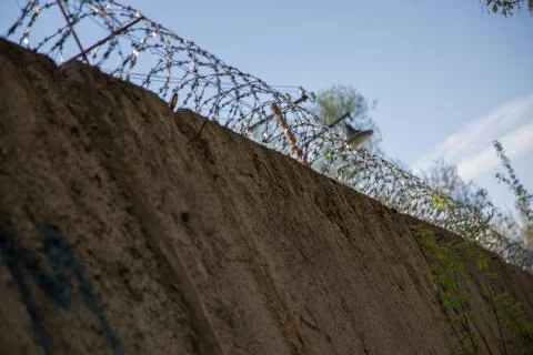 Barbed wire prison wall forbidden zone background 写真素材
