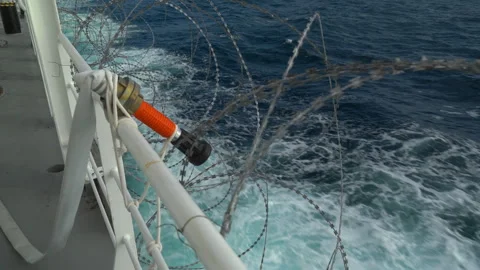 Barbed wire on railing of vessel. Protection from pirates. Open deck in barbed Stock Footage 242540812