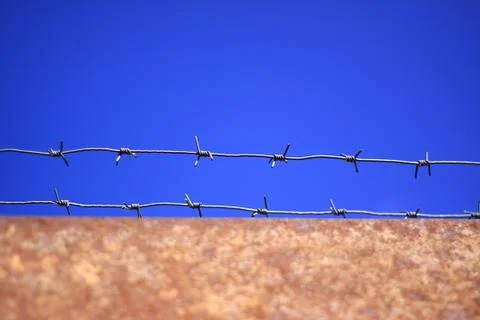 Barbed wire on rusty gates Stock Photos