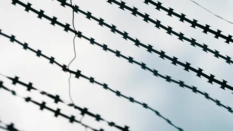 Barbed wire securing the prison. Stock Footage 303553214
