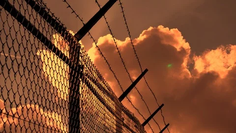 Barbed Wire Silhouette, Sunset, Clouds Timelapse Stock Footage 106614371