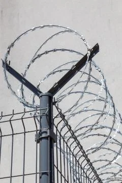 Barbed wire on sky background Stock Photos