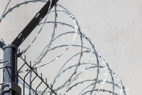 Barbed wire on sky background Stock Photos