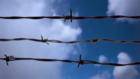Barbed Wire With Speed Clouds Concept Stock Footage 236258584