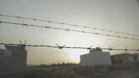 Barbed wire sunset in Iraq Stock Footage 87760530