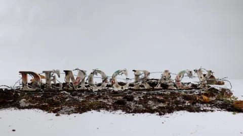 Barbed wire wraps around the word democracy against white backdrop 스톡 동영상 319442540