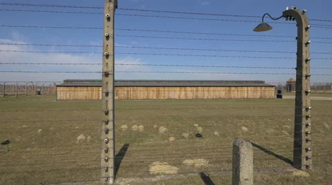 Barbed wires and barracks at Auschwitz Stock Footage 52778490
