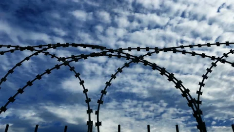 Barbed wires with changing sky background Stock Footage 201256282