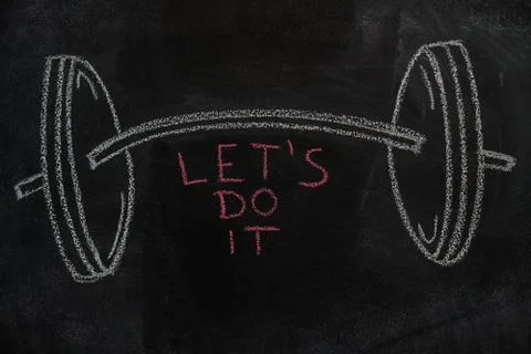 Barbell and Let's do it text on black chalkboard Stock Photos
