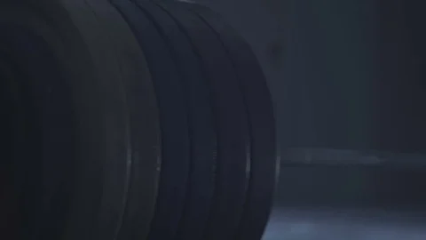 Barbell rests on the floor Stock Footage 77183598