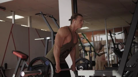 Barbell row of fit guy Stock Footage 118075021