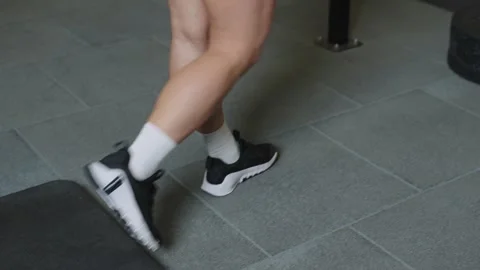 Barbell training session in gym focusing on foot placement and technique Video stock 331019556