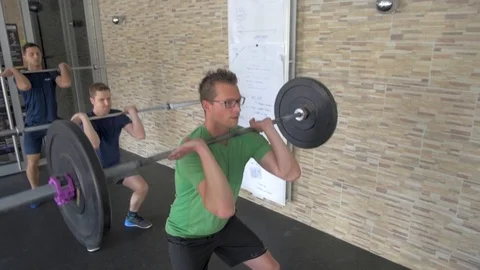 Barbell weight lifting group workout exercise at gym box Stock Footage 112672751
