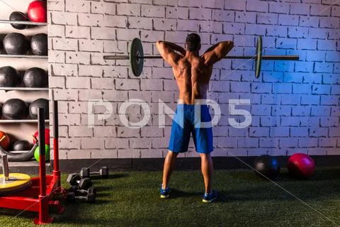 Barbell weight lifting man rear view workout gym Stock Photos