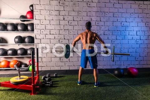 Barbell weight lifting man rear view workout gym Stock Photos