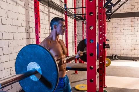 Barbell weight lifting man weightlifting at gym Stock Photos