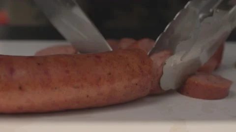 Barbeque BBQ Close Up Knife Cutting Sausage Slow Motion Video stock 205009163
