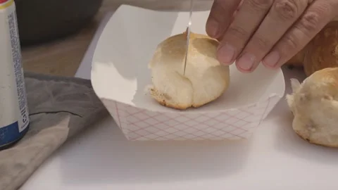 Barbeque BBQ Close Up Knife Cutting Through Biscuit Slow Motion Video stock 205009174