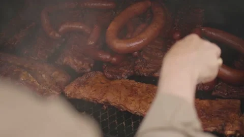 Barbeque BBQ Hand Moves Meat On Smoker Slow Motion Stock-Footage 205009201
