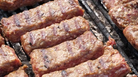 Barbeque with meat on a sunny day Stock Footage