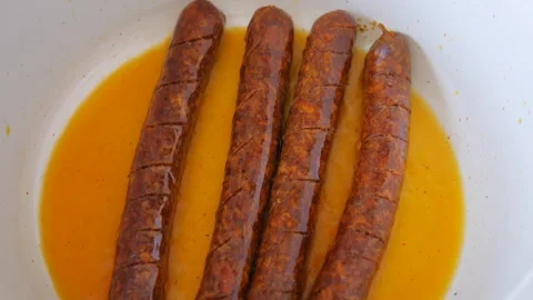 Barbeque sausages on the frying pan Stock Footage 342501023
