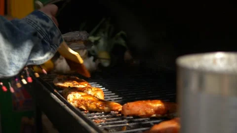 Barbeque - Turning meat on the grill 스톡 동영상 145326204