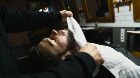 Barber cleans customers neck after shaving slow motion Video stock 60051078