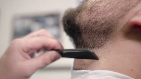 Barber comb and trim beard Stock Footage 160436546
