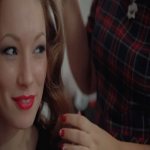 Barber comb twists a lock of red hair young woman. Stock Footage 69537301