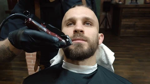 Barber combs beard close up. Stock Footage 86917646