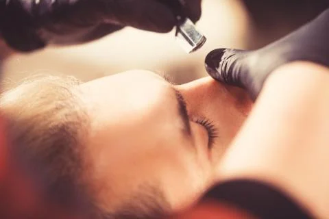 Barber cut eyebrows. close-up. Make eyebrows the right shape. barber haircut. Stock Photos