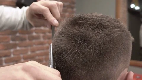 Barber cut the neck of the client with scissors for thinning close-up 4k. Stock Footage 81513128