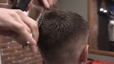 Barber cuts the back of the client with scissors close-up 4k. Stock Footage 81507124