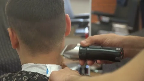 Barber Cuts the Hair in the Barbershop Stock Footage