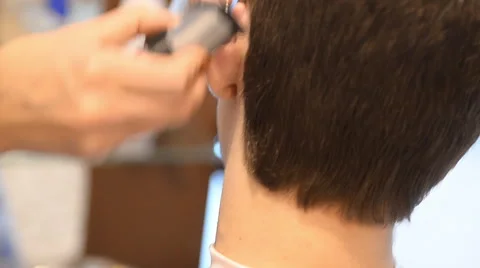 Barber cuts the hair of the client with clipper 動画素材 59846995