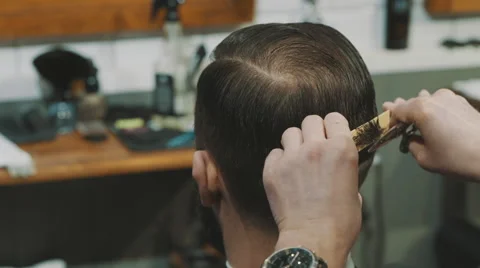 Barber cuts the hair of the client with scissors Stock-Footage 46729678
