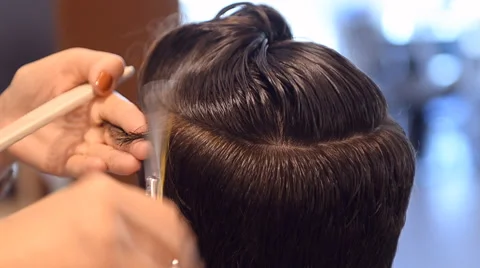 Barber cuts the hair of the client with scissors Stock Footage 59846971