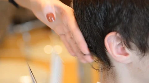 Barber cuts the hair of the client with scissors Stock Footage 59846991
