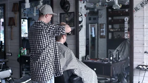 Barber cuts the hair of the client with scissors Stock Footage 62948466