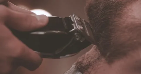 Barber cutting beard electric clipper barbershop HD slow motion close-up video Stock Footage 68378569