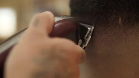 Barber cutting client hair with razor electric slow motion Stock-Footage 80790572