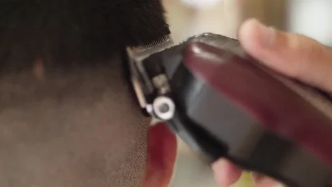 Barber cutting client hair with razor electric slow motion Stock Footage 80790853