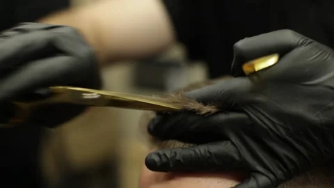 Barber Cutting Man With Scissors Under Comb. Man Having Hair Cut In Barbershop Stock Footage 139765032