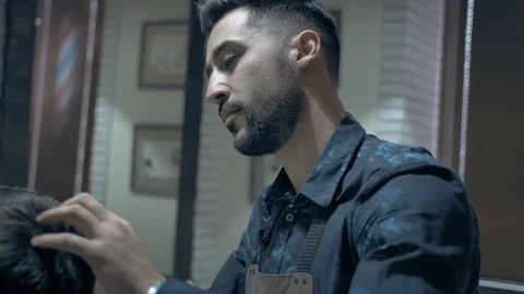 Barber does hair styling Stock Footage 88046337