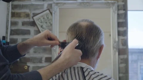 The Barber does a haircut on the back of the head Stock Footage 124535598